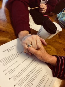 grasped hands across the divide